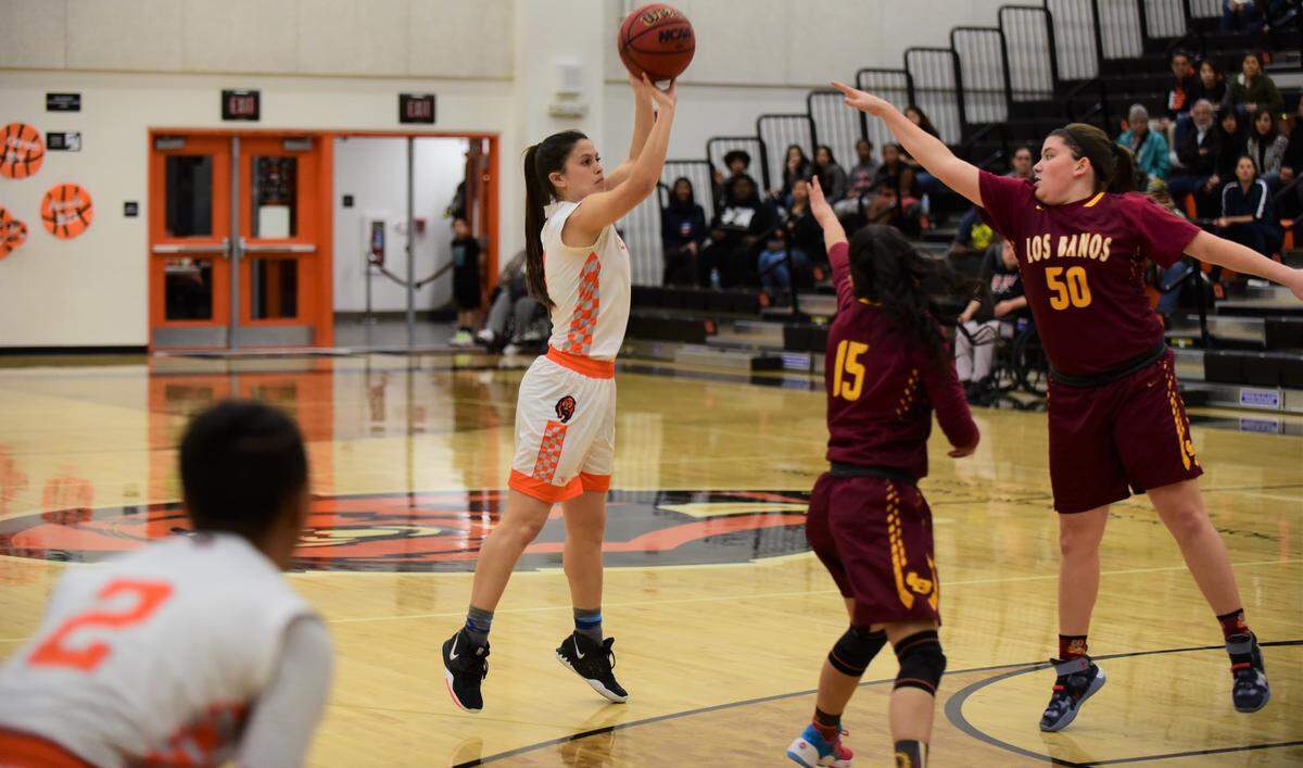 Merced High senior Kaitlynn Perez goes up for a shot against Los Banos during a playoff game at Clemons Court at Merced High School.