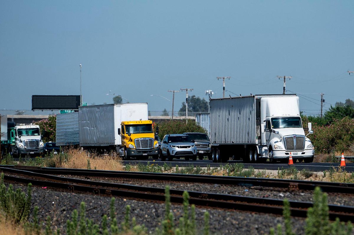 A crash involving an overturned Foster Farms big rig slows traffic along southbound Highway 99 just north of Franklin Road in Merced County, Calif., on Wednesday, Aug. 23, 2023. According to the California Highway Patrol, the driver of the truck was not injured.