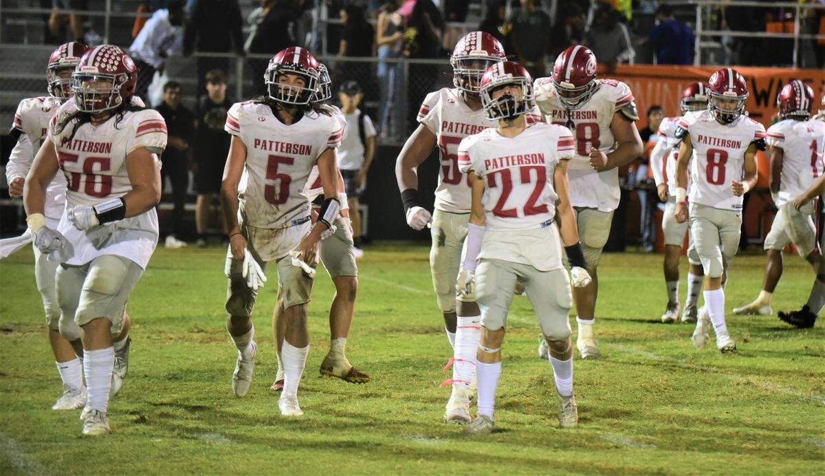 Patterson High School playes celebrate after defeating Merced 24-21 in a Central California Conference showdown in Merced, Calif. on Friday, Sept. 23, 2022.