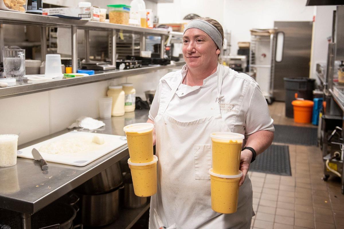 Sous-chef Cassandra Horn, 41, prepares nacho cheese for the new menu at the historic Mainzer Theater in Merced, Calif., on Thursday, Aug. 15, 2024. A new menu crafted by Executive Chef Evan Morrison, is set to debut on Friday Aug. 16.