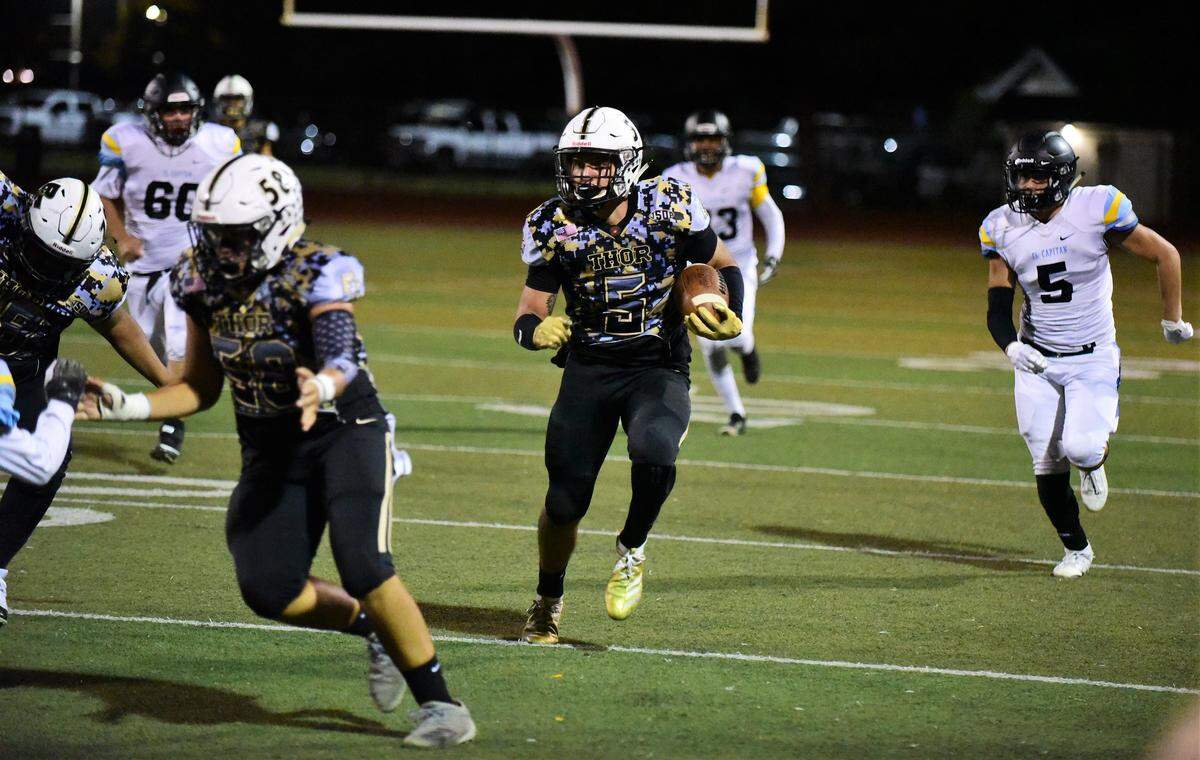Buhach Colony’s Nate Ruiz heads up field after catching a screen pass against El Capitan on Thursday, Oct. 3, 2019 at Dave Honey Stadium.
