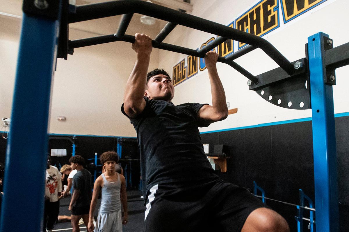 El Capitan senior football player Emiliano Ibarra, 17, works out with teammates at El Capitan High School in Merced, Calif., on Thursday, Sept. 5, 2024.
