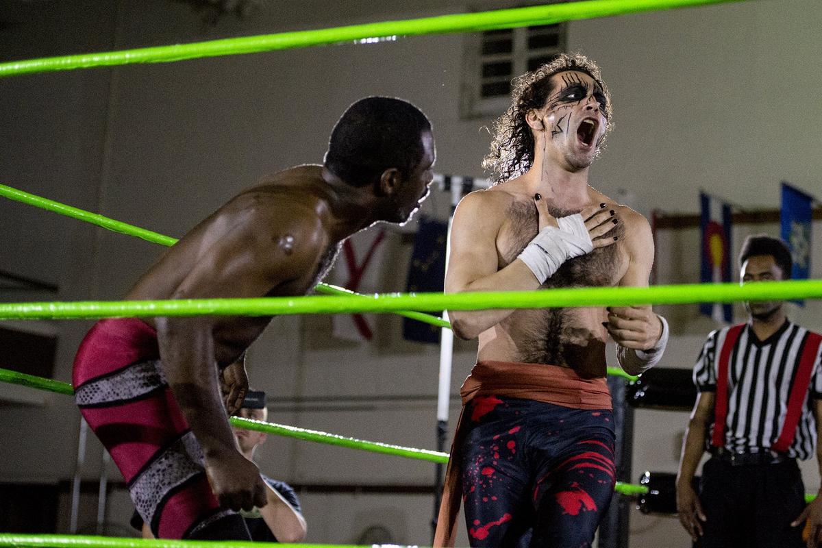 Wrestler Sheik Khan Abadi, right, reacts after taking a chop to the chest by opponent Virgil Flynn III, left, during the "Best of the West" live wrestling promotion at the American Legion Post 83 hall in Merced, Calif., on Saturday, May 19, 2018.