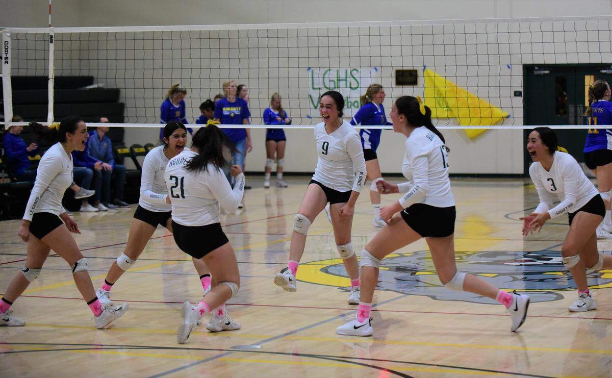 The Le Grand girls volleyball team celebrates a point during a playoff match against Ripon Christian on Tuesday, Nov. 5, 2019 at Le Grand High.