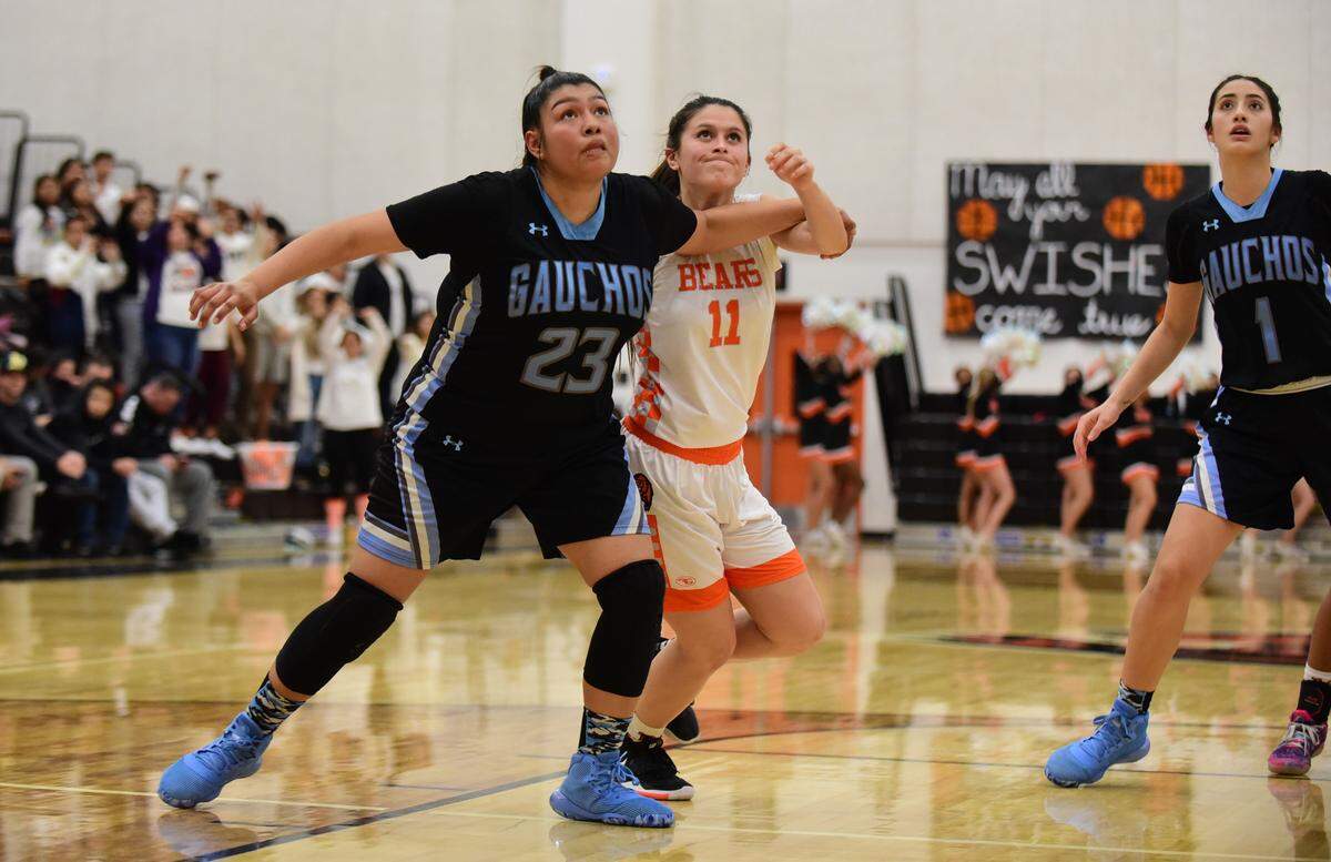 Merced High’s Kaitlynn Perez fights for a rebound against El Capitan’s Rosealyn Delgado during a game on Thursday, Jan. 30, 2020 at Merced High’s Vince Clemons Court.