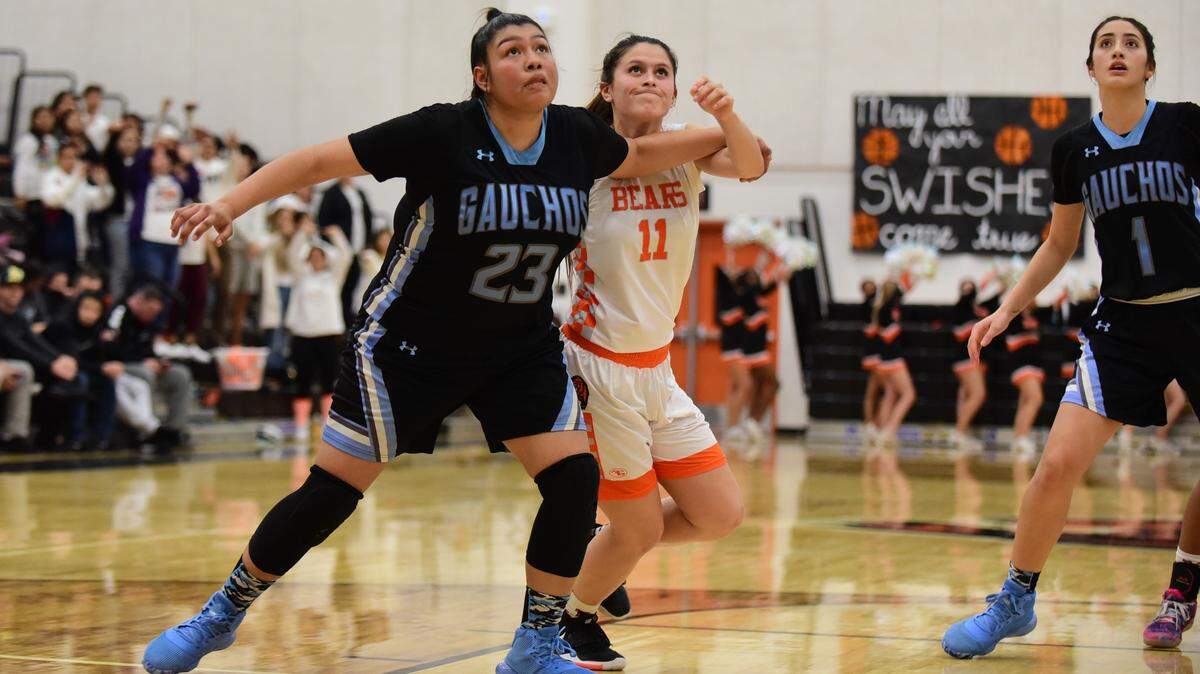 Merced High’s Kaitlynn Perez fights for a rebound against El Capitan’s Rosealyn Delgado during a game on Thursday, Jan. 30, 2020 at Merced High’s Vince Clemons Court.