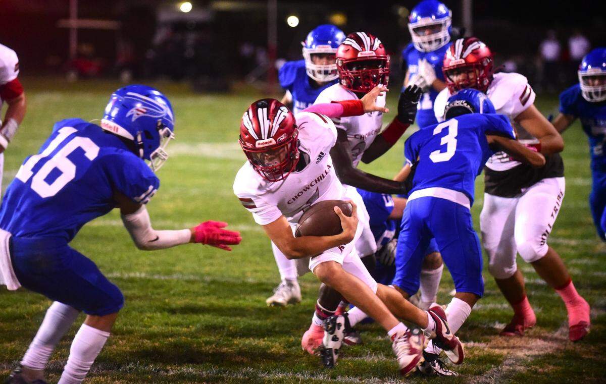 Chowchilla High School quarterback Davian Stephenson runs the ball during a game against Caruthers on Friday, Oct. 20, 2023.