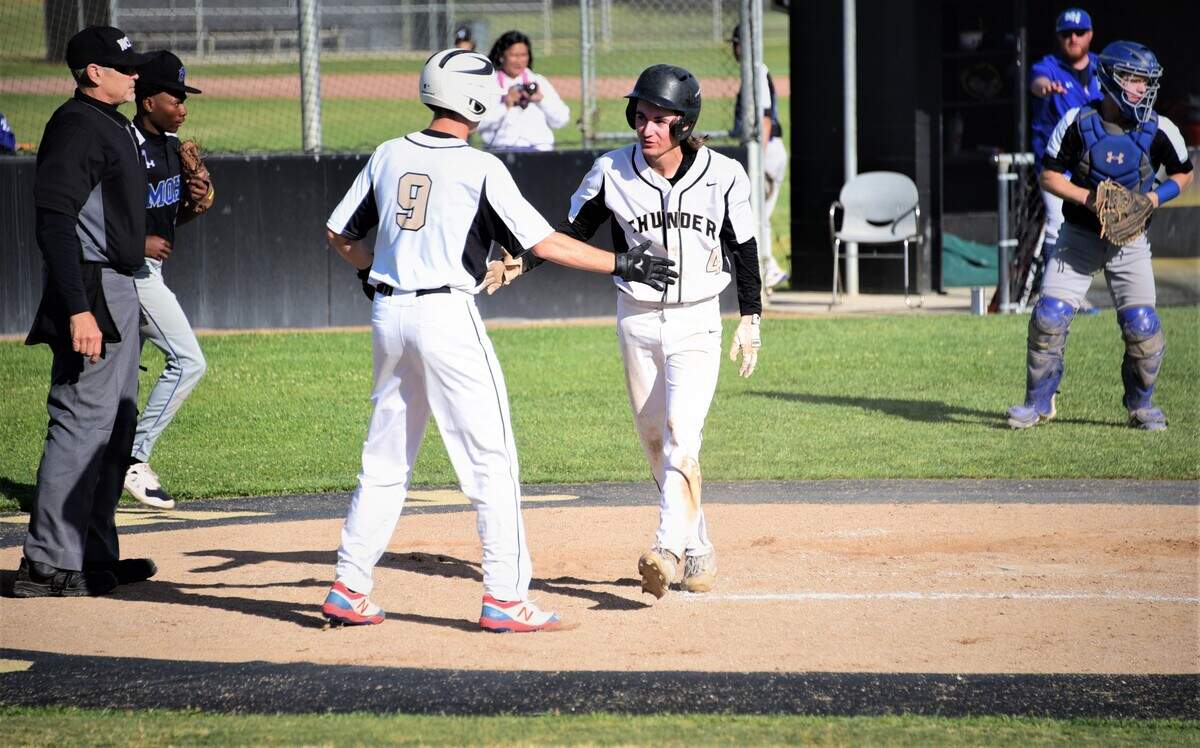 Buhach Colony’s Kadyn Fillebrown is congratulated after scoring a run by teammate Landon Laplante during a 3-1 playoff win over Mountain House on Tuesday, May 10, 2022 at Buhach Colony High School in Atwater, Calif.