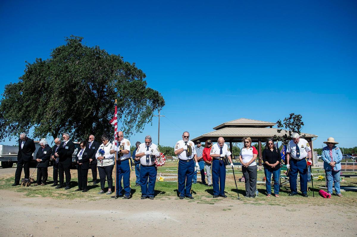 Veterans and community members gather during a Memorial Day ceremony at the Los Banos Cemetery, located at 16575 Center Avenue in Los Banos, Calif., on Monday, May 30, 2022.