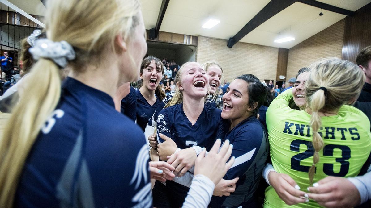 Stone Ridge Christian players celebrate after winning the CIF NorCal Division VI Regional Championship against Forest Lake Christian at First Baptists Merced in Merced, Calif., on Tuesday, Nov. 13, 2018. The Knights beat the Falcons 3-0.