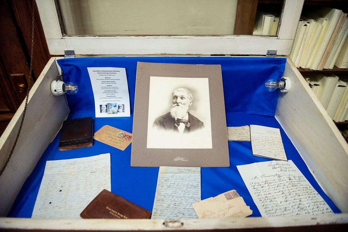 A photo of James Cunningham along with letters of correspondence from his family members dating back to 1851, inside the collection of archives at the Merced County Courthouse Museum in Merced, Calif., on Wednesday, Sept. 18, 2024. Cunningham traveled to Merced County from Ireland and helped organize the county in 1855.