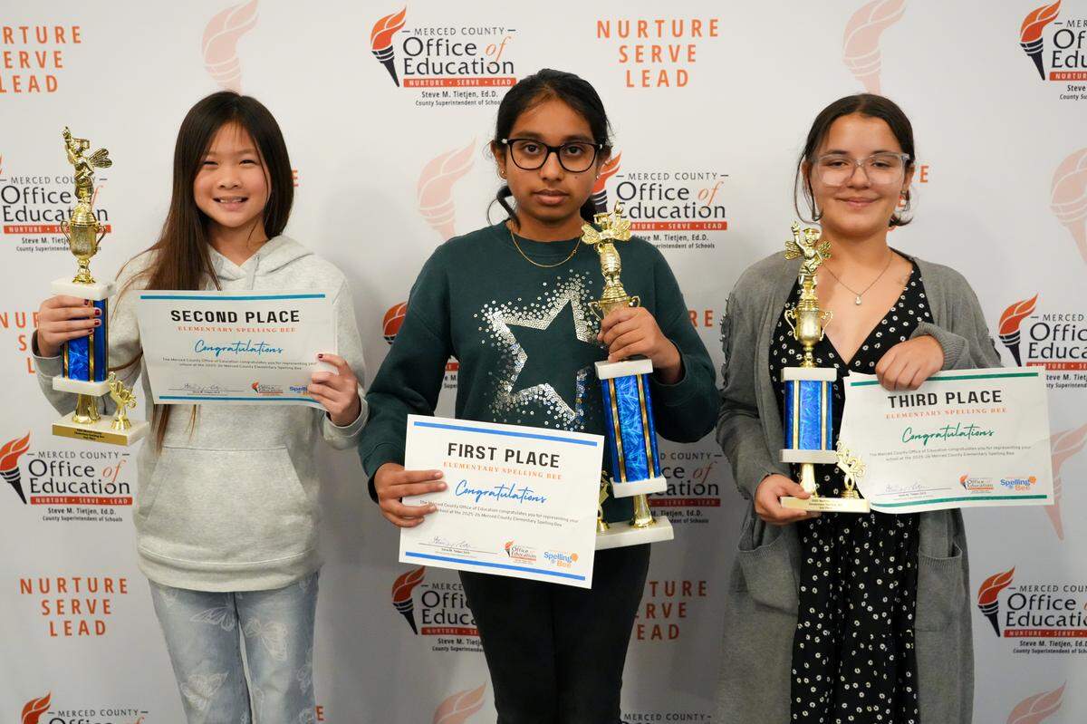 Merced County elementary school spelling bee winners hold their trophies.