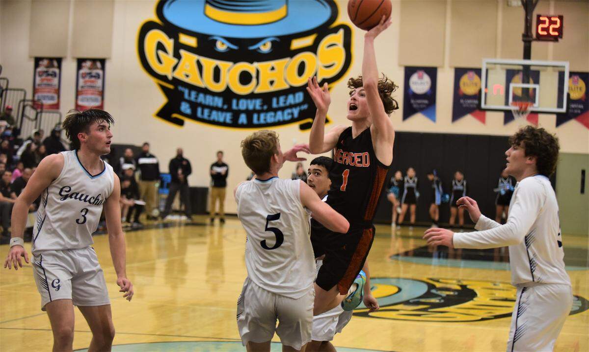 Merced High junior Aiden Cervantes (1) goes up for a shot during a game on Wednesday, Jan. 4, 2022 at El Capitan High School.