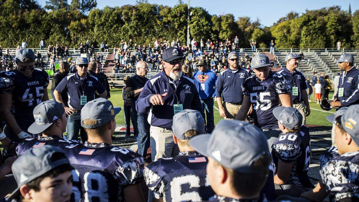 Stone Ridge Christian head coach Arthur DeJager speaks to his team after defeating Big Valley Christian 69-0 in the Sac-Joaquin Section Division VII championship at Lincoln High School in Stockton, Calif., Saturday, Nov. 28, 2015. Stone Ridge Christian announced DeJager is returning as the Knights head football coach.