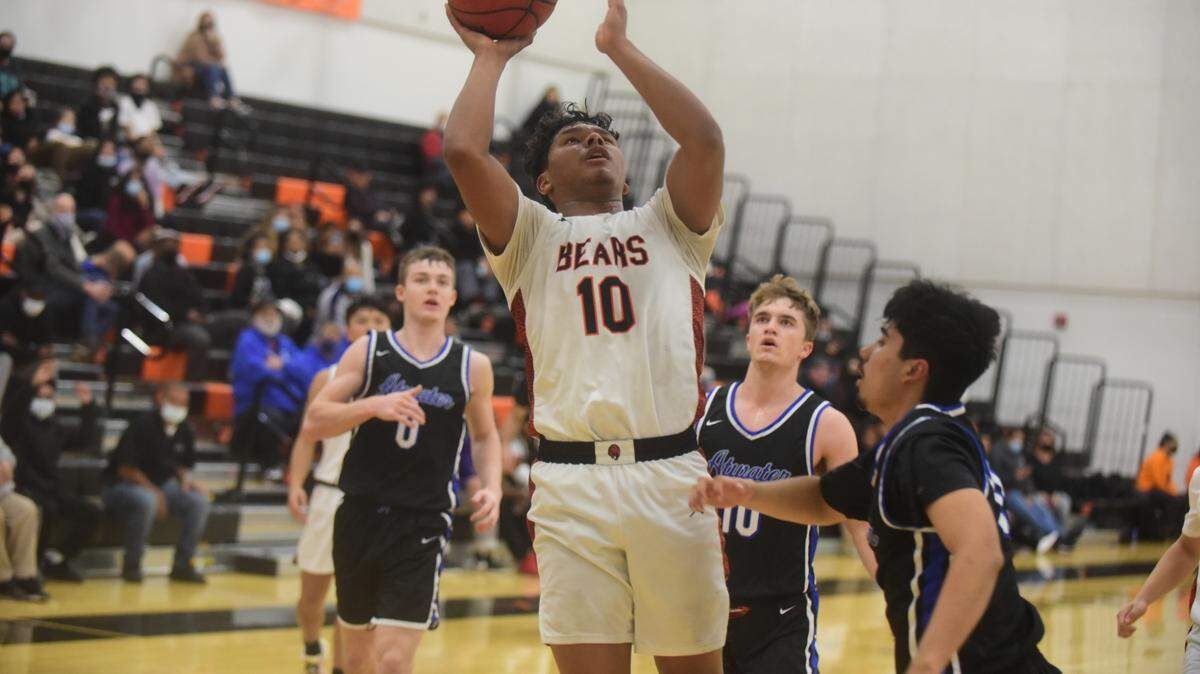 Merced High senior Jaylen Thao-Booth scores two of his 20 points to lead the Bears to a 63-45 win over Atwater on Wednesday, Feb. 2, 2022 at Merced High School.