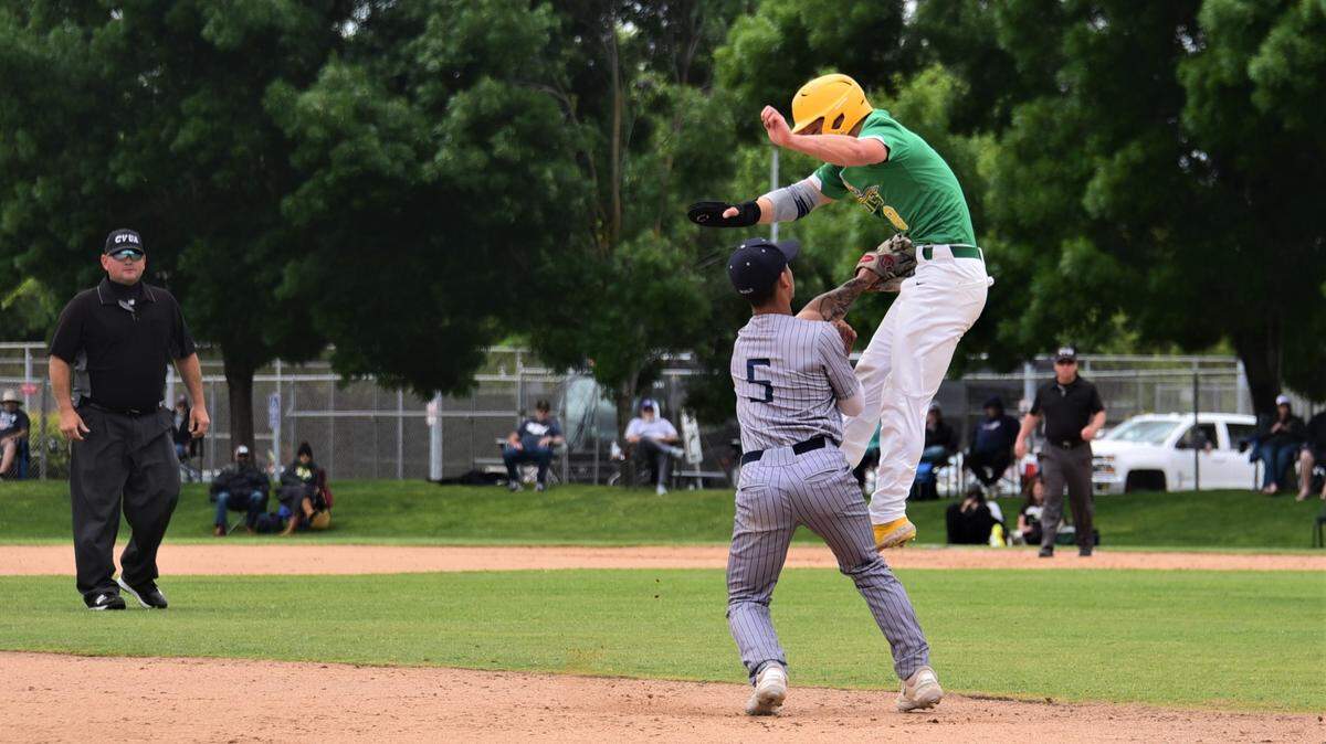 Merced College third baseball Jacob Reyna tags out Canada College’s Joey Lee as he tries to leap to avoid the tag during a playoff game at Blue Devil Diamond on Saturday, May 6, 2023.