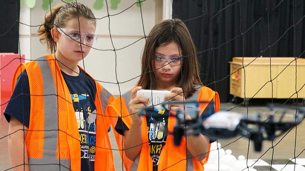 Young people fly in drones in the Drone Cage, where they try to avoid obstacles and experience the growing field of unmanned-vehicle flight. This and other science-based activities will be offered by UC Merced to people attending the Merced County Fair.