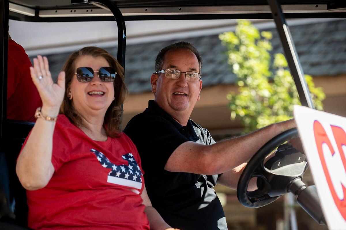 Atwater Mayor Paul Creighton, right, drives along Broadway Avenue during a Fourth of July parade in Atwater, Calif., on Monday, July 4, 2022.