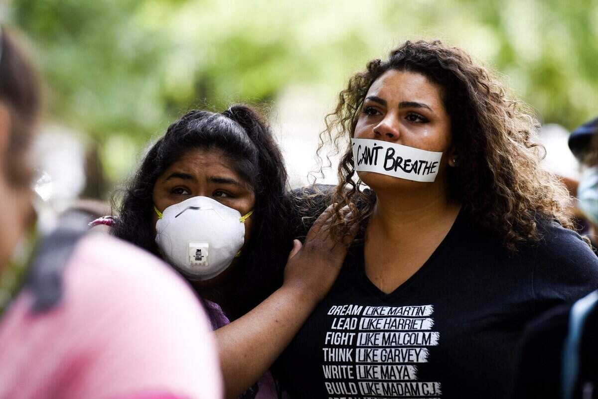 Jessica Betancourt, left, and Kidra Avery, right, were among those who participated in a protest Saturday, May 30, 2020 near Merced’s Court House Park in remembrance of George Floyd. People nationwide took to the streets Friday and Saturday to protest the recent killing of Floyd by a police officer in Minneapolis.