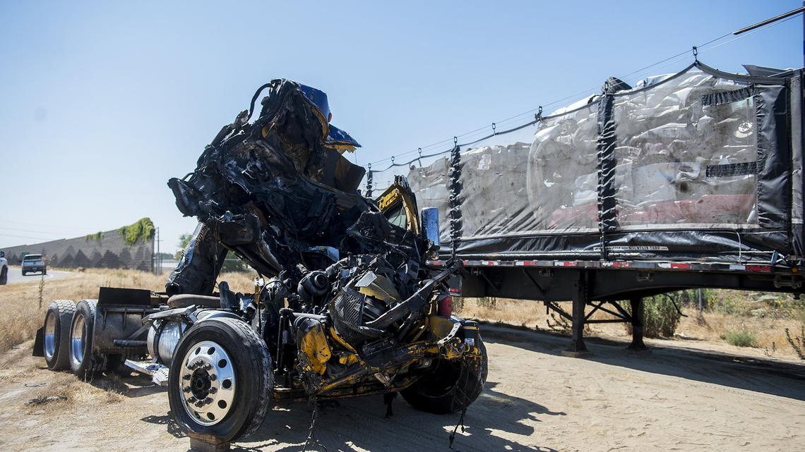 A tractor-trailer that was hauling about 6,500 gallons of wine, is seen after it was towed from the crash site on Highway 99 just south of Westside Boulevard near Atwater, Calif, on Saturday, Aug. 18, 2018. According to California Highway Patrol officer Eric Zuniga, the 27-year-old driver who was pulled from the wreckage, suffered major injuries when the truck he was driving in the northbound lanes, for unknown reasons, jumped to the right shoulder and struck another big rig that was stopped on the shoulder. The 27-year-old driver was transported to a Modesto area hospital and the driver of the stopped big rig was not hurt, according to Zuniga.