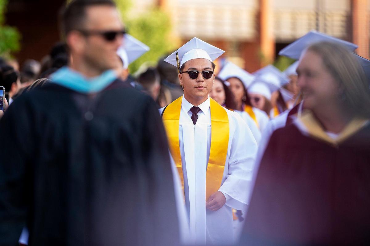 Graduates enter during a commencement ceremony for the El Capitan High School class of 2022 on the El Capitan High School campus in Merced, Calif., on Thursday, June 2, 2022.