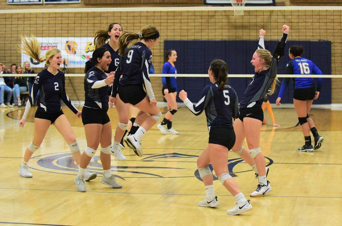 The Stone Ridge Christian girls volleyball team celebrates after clinching the Northern California Regional Division VI championship against Fall River on Tuesday, Nov. 19, 2019.