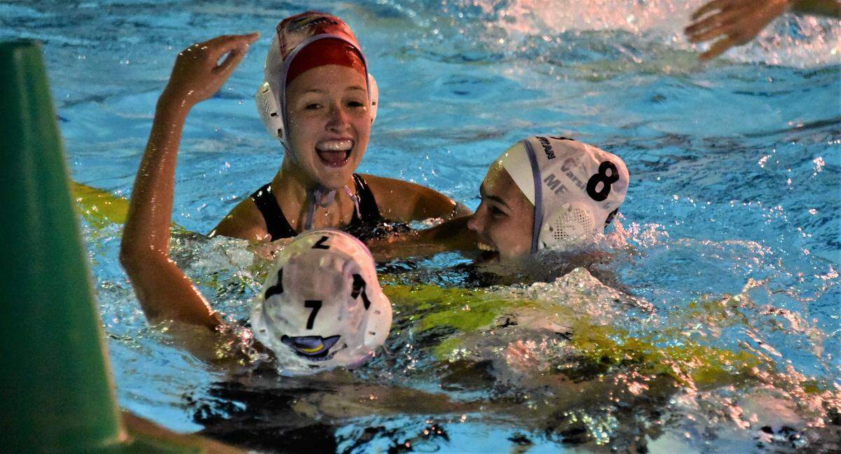 El Capitan High goalie Caitlin Battle Edwards celebrates with teammates Brooklyn Ramsey (7) and Ellie Metcalf (8) after the Gauchos defeated Buhach Colony 9-8 in overtime to earn a share of the Central California Conference championship on Tuesday, Oct. 25, 2022.