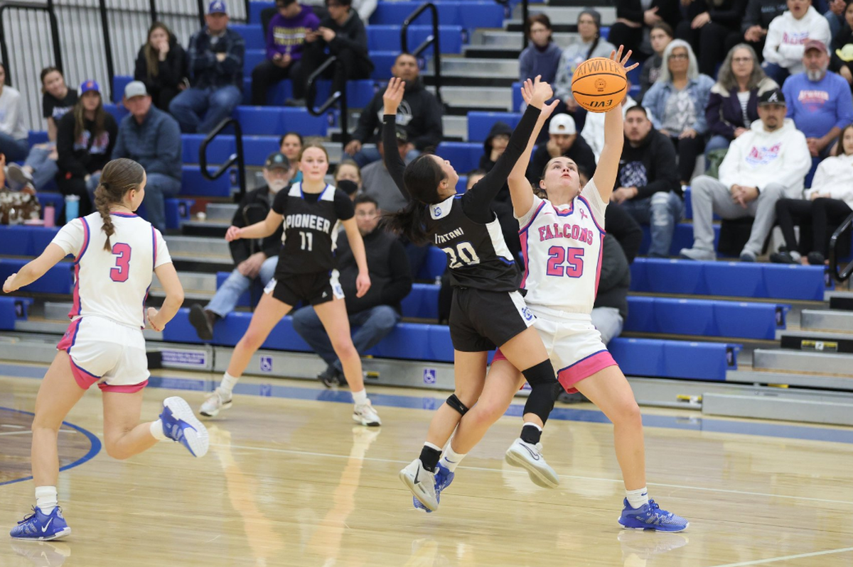 Atwater High junior Karissa Hukill (25) battles for the ball against Pioneer’s Cassie Itatani (20) during a NorCal playoff game on Tuesday, Feb. 27, 2024 in Atwater, Calif.