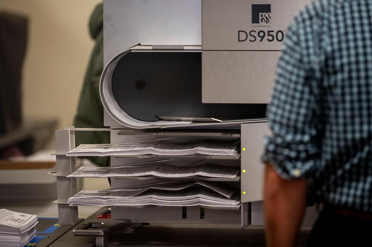 Ballots are run through a vote tabulator machine at the Merced County Election Warehouse in Merced, Calif., on Thursday, Nov. 7, 2024. Election officials and workers continue to count tens of thousands of ballots following the Nov. 5, General Election.