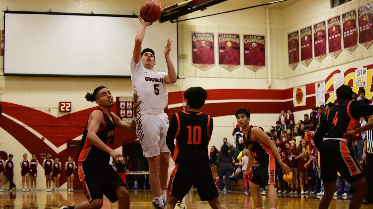 Golden Valley senior Christian Magallanes goes up for a shot against Merced High during a game on Friday, Feb. 14, 2020 at Cougar Arena.