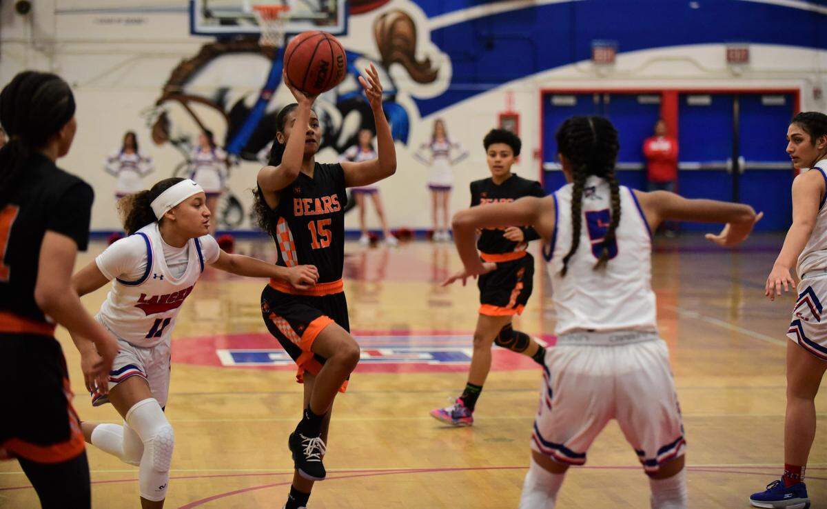 Merced High School junior Anaya Seals shoots a floater against East Union during a playoff game on Thursday, Feb. 20, 2020 at East Union High School in Manteca, Calif.