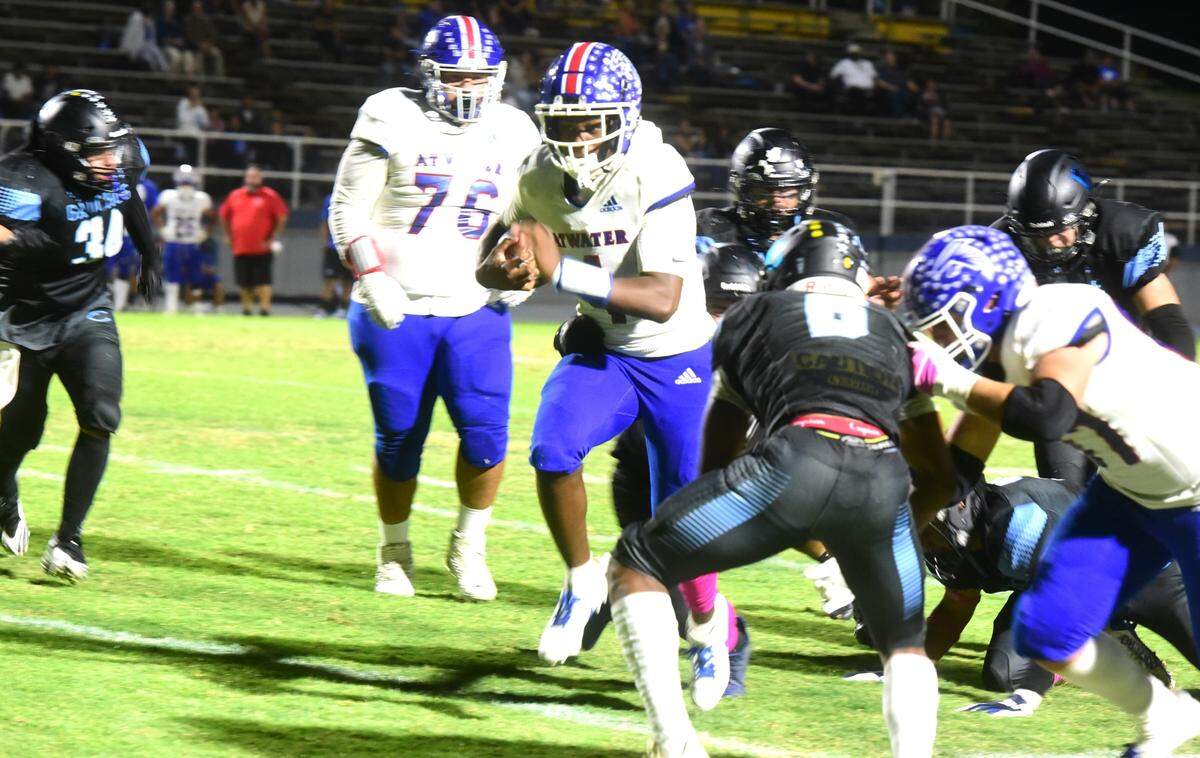 Atwater High quarterback AJ Banks runs the ball during a game against El Capitan on Friday, Oct. 11, 2024 at Stadium ’76.