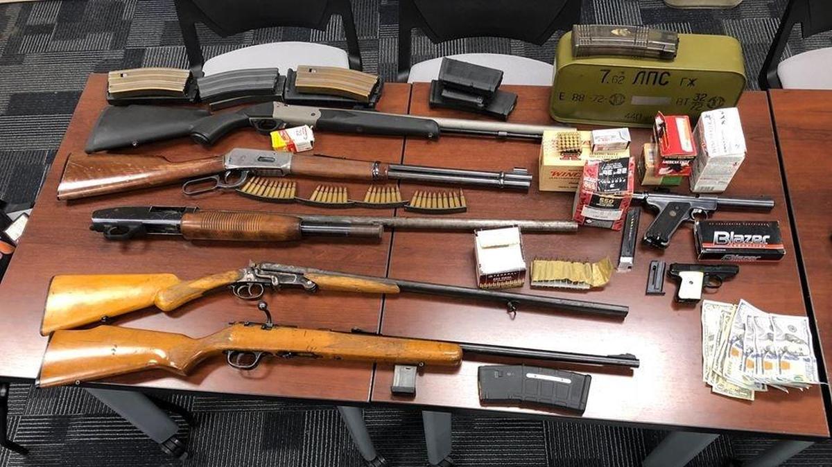 Weapons, ammunition and illegal high capacity magazines recovered during a search of two residences, according to Chowchilla police. Photo courtesy of the Chowchilla Police Department.