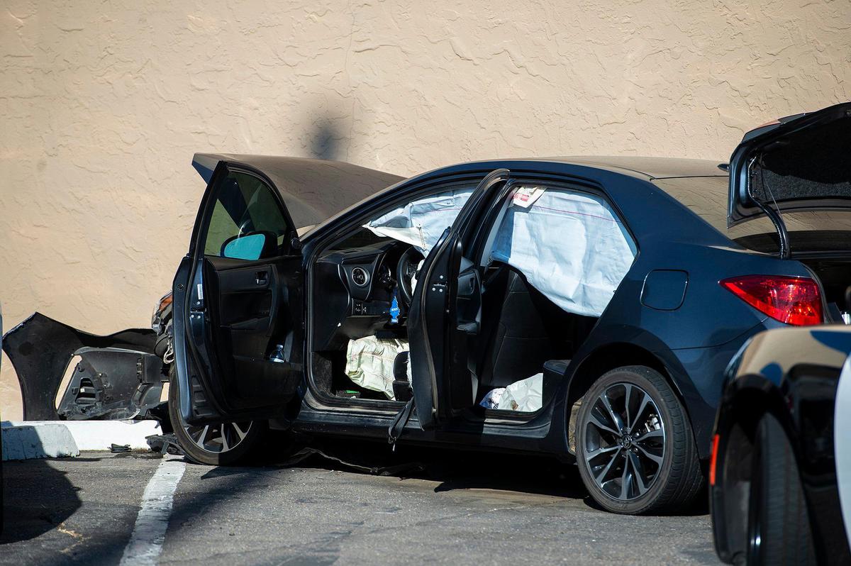 A Toyota Camry sits in parking lot along West 16th Street as Merced Police, Merced City Fire Department and Riggs Ambulance Service respond to the scene of a hit-and-run collision near the intersection of Martin Luther King Jr. Way and West 16th Street in Merced, Calif., on Sunday, July 19, 2020. Authorities said the driver of the Toyota left before officers arrived on scene. The driver of a Ford Ranger involved in the collision, was transported to an area hospital for treatment of injuries, police said. According to authorities, the crash is under investigation.
