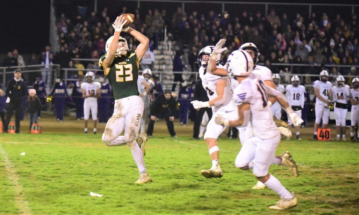 Hilmar High senior receiver Derek Taylor hauls in a 49-yard reception against Escalon during a playoff game on Friday, Nov. 11, 2022, at McSweeney Field in Hilmar, Calif.
