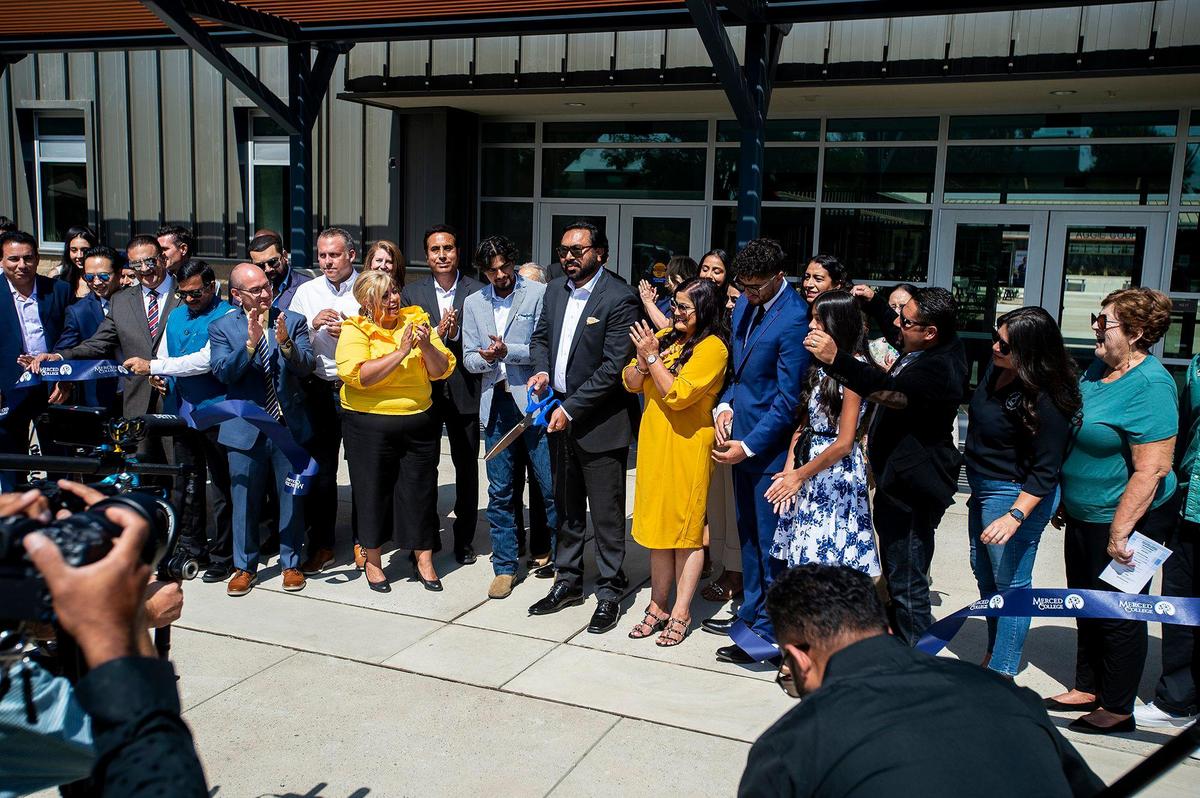 Raj Kahlon cuts the ribbon ceremony for the Raj Kahlon Agriculture and Industrial Technology Complex on the Merced College campus in Merced, Calif., on Thursday, Sept. 15, 2022. According to Merced College, the new 29,000- square-foot facility is state of the art and will allow the college to train additional students for jobs in agriculture as well as industrial technology and other workforce programs.