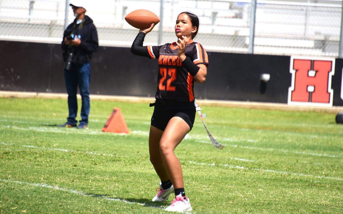 Merced High sophomore quarterback Antonia Lejarde throws a pass during a flag football game against Heritage on Saturday, Aug. 24, 2024.