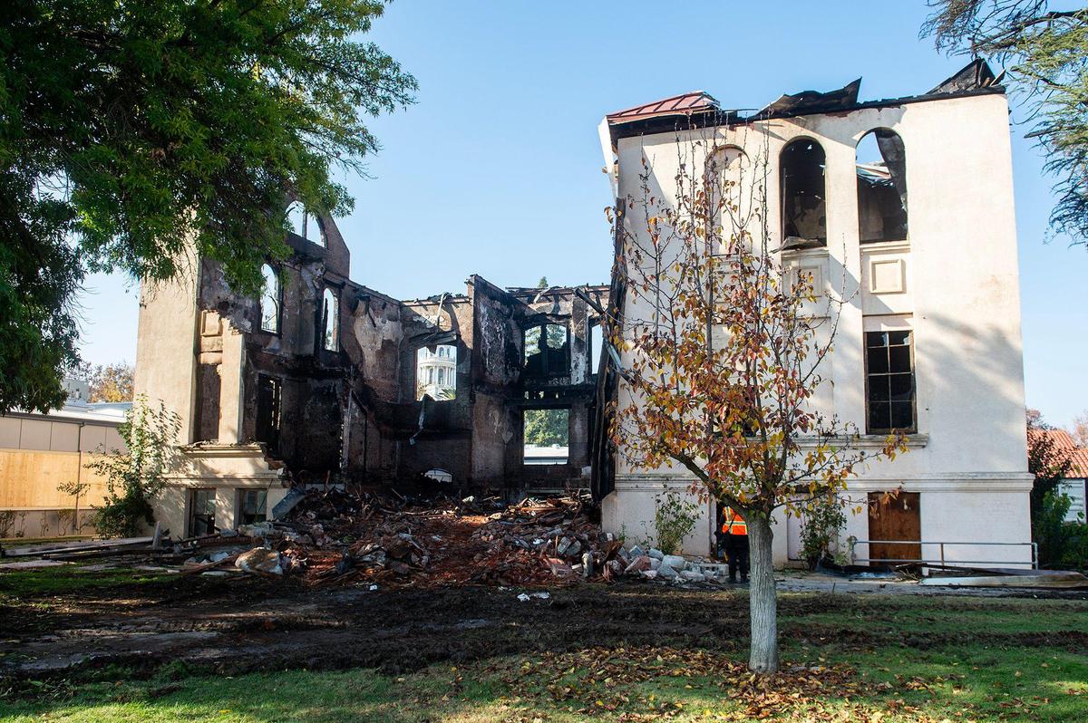 The remains of a historic 19th century building and the first Merced County building constructed as a high school, after a fire damaged the structure located at 2125 M Street in Merced, Calif., on Tuesday, Dec. 3, 2024. Both city and county firefighters responded to the blaze which broke out inside the structure Monday morning.