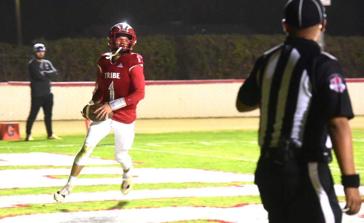 Chowchilla High quarterback Davian Stephenson (1) finds the end zone on one of his five rushing touchdowns in the first half against Minarets on Friday, Oct. 18, 2024 at Henry Massaro Stadium.