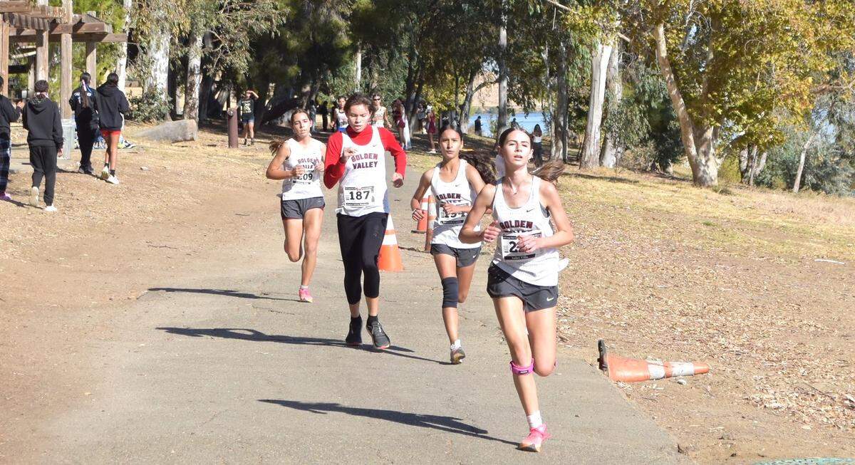 The Golden Valley High girls cross country team clinched the first Central California Conference championship in school history during Wednesday’s third conference meet in Los Banos, Calif. Cougars runners (from right to left) Aubri Villa, Fernanda Cortes, Ciarra Cabrera-Martinez and Gabriela Hicks compete during Wednesday’s race.