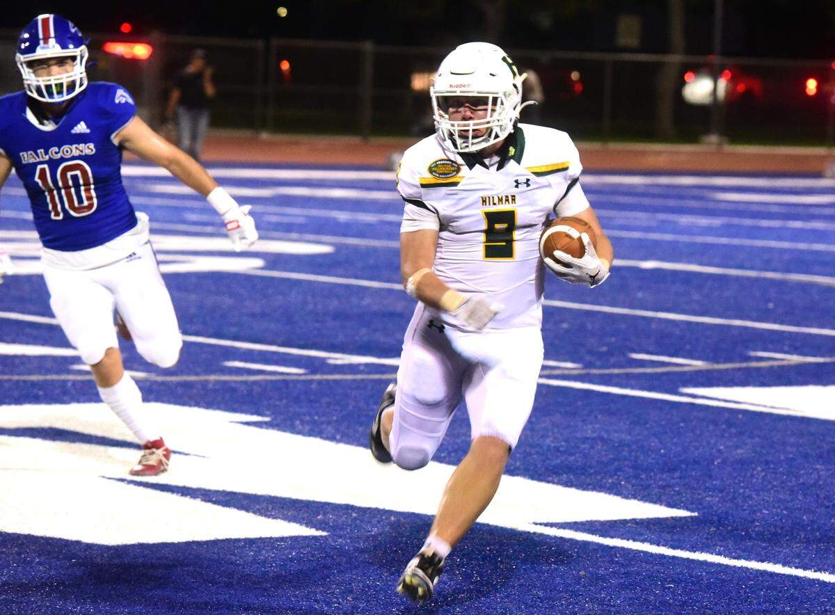 Hilmar High senior Caden Bailey (9) runs the ball up field during a game against Atwater on Friday, Sept. 13, 2024.