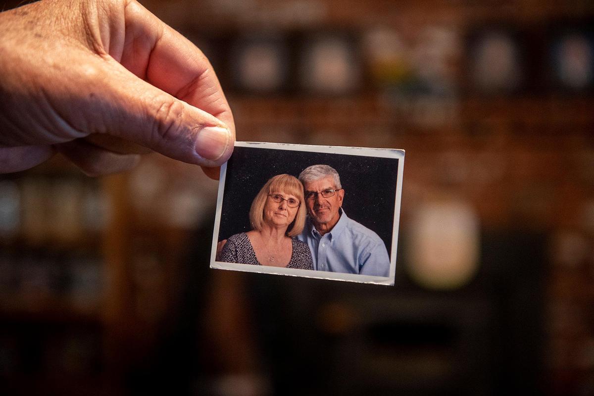 Bob Edwards, 76, holds a photo of he and wife Billie Edwards, at their home in Atwater, Calif., on Thursday, Nov. 3, 2022. Family members said Edwards, 73, and her sister Carolyn Rose, 76, of Atwater, were walking along East Juniper Avenue on Nov. 2, when they were struck and killed by a vehicle. Authorities said the vehicle was traveling westbound on East Juniper Avenue when it left the roadway striking the women and a light pole.
