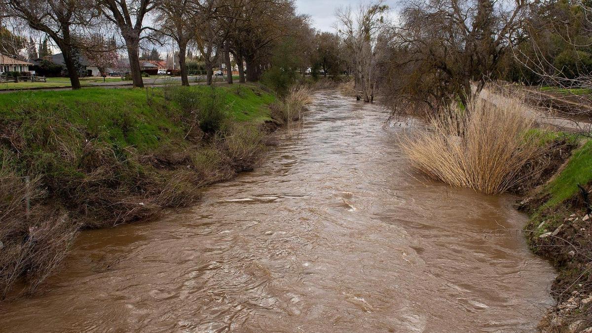 Bear Creek flows past McKee Road in Merced, Calif., on Sunday, March 12, 2023.