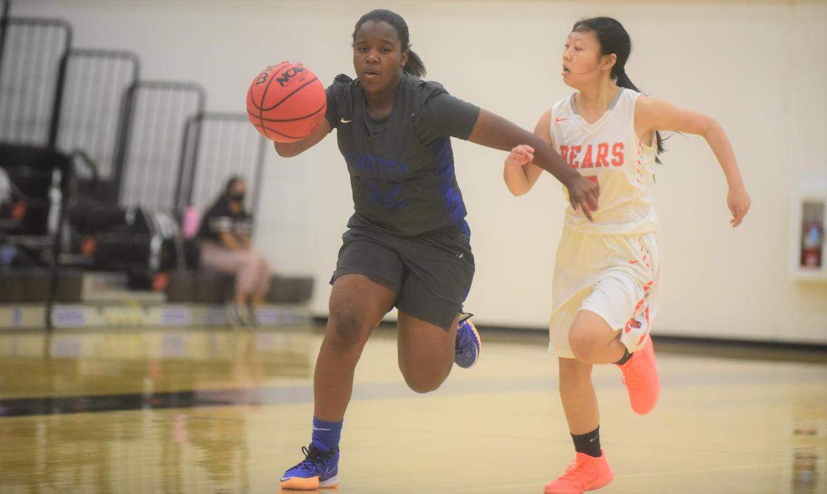Atwater High senior Amoni Claiborne dribbles up the court against Merced on Tuesday, May 11, 2021.