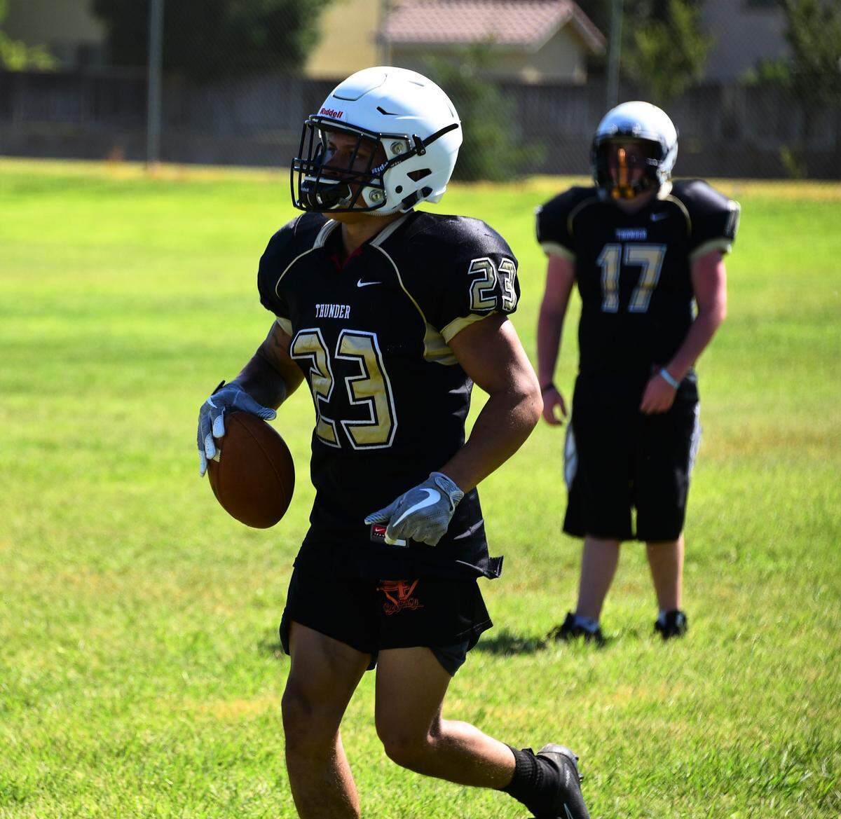 Buhach Colony senior Youlas Dickson hauls in a catch during a Thunder practice.