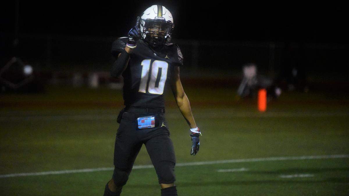 Buhach Colony senior Jalon Jackson signals to his sideline after preventing a Merced receiver from catching a pass down field during Friday night’s 17-13 win by the Bears in Atwater, Calif.