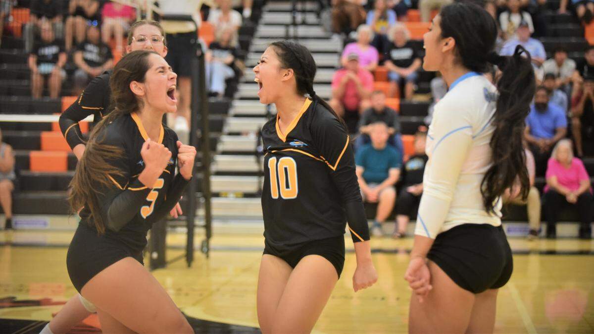El Capitan High School seniors Hanna Moradzedeh (5), Wendy Vang (10) and Leah Mendoza (6) celebrate a point during a 3-0 sweep of Merced on Wednesday, Sept. 7, 2022 at Merced High School.
