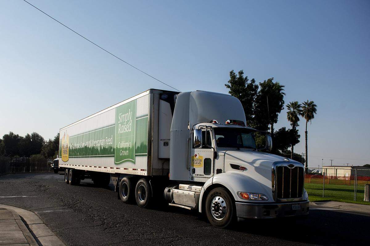 Vehicles including Foster Farms trucks enter and exit the Foster Farms facility located at 1000 Davis Street in Livingston, Calif., on Thursday, Aug. 27, 2020.