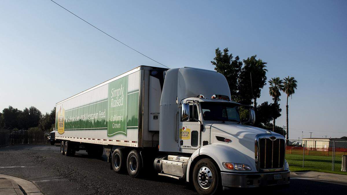 Vehicles including Foster Farms trucks enter and exit the Foster Farms facility located at 1000 Davis Street in Livingston, Calif., on Thursday, Aug. 27, 2020.