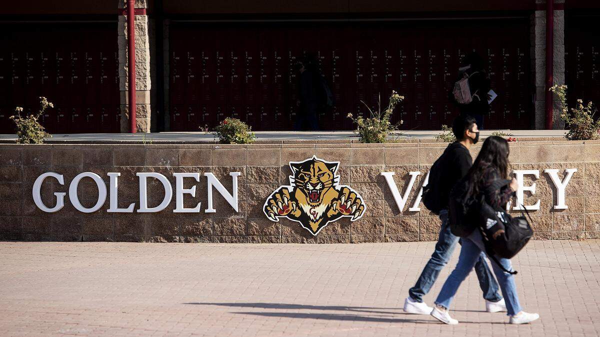 Students walk across the campus at Golden Valley High School in Merced, Calif., on Monday, Nov. 2, 2020.